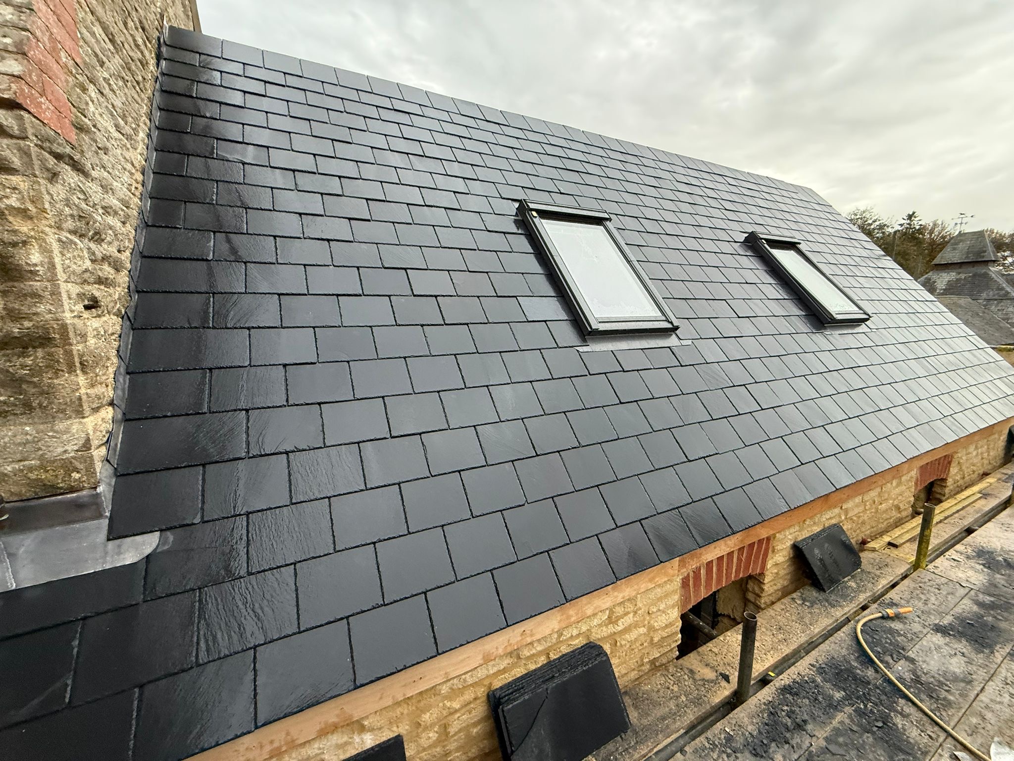 Completed slate roof with roof windows